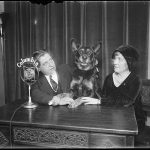 Thomas Schall, his guide dog, and an unidentified woman