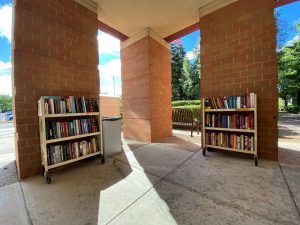 book cart filled with books outside