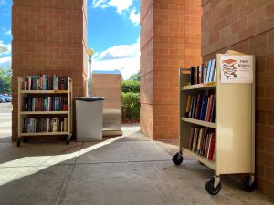 book cart outside filled with books