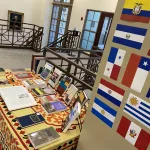 Flags on a wall and book display