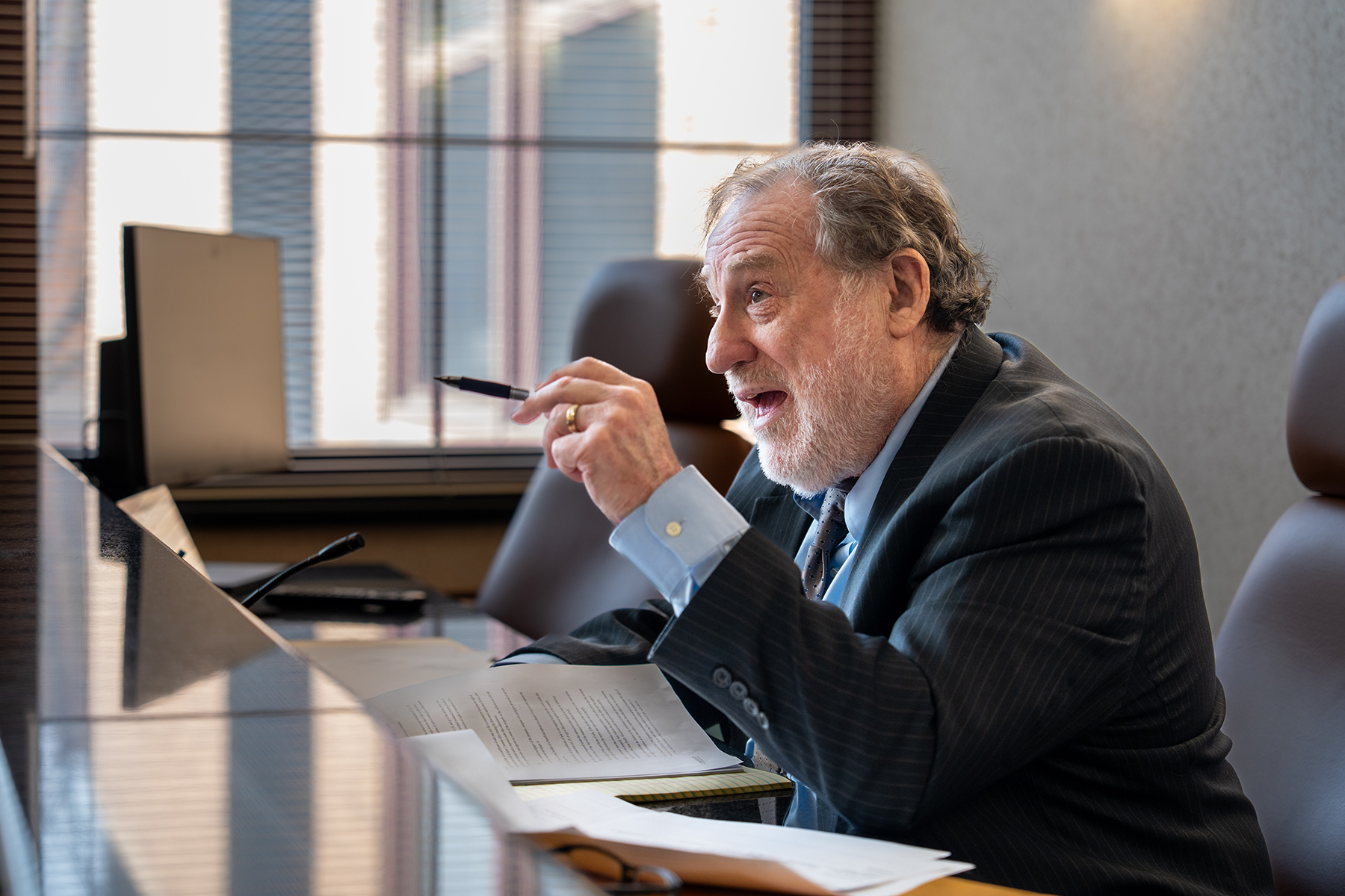 man pointing and speaking