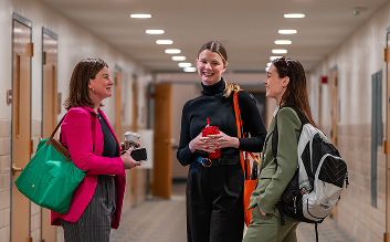 People standing and talking in hallway